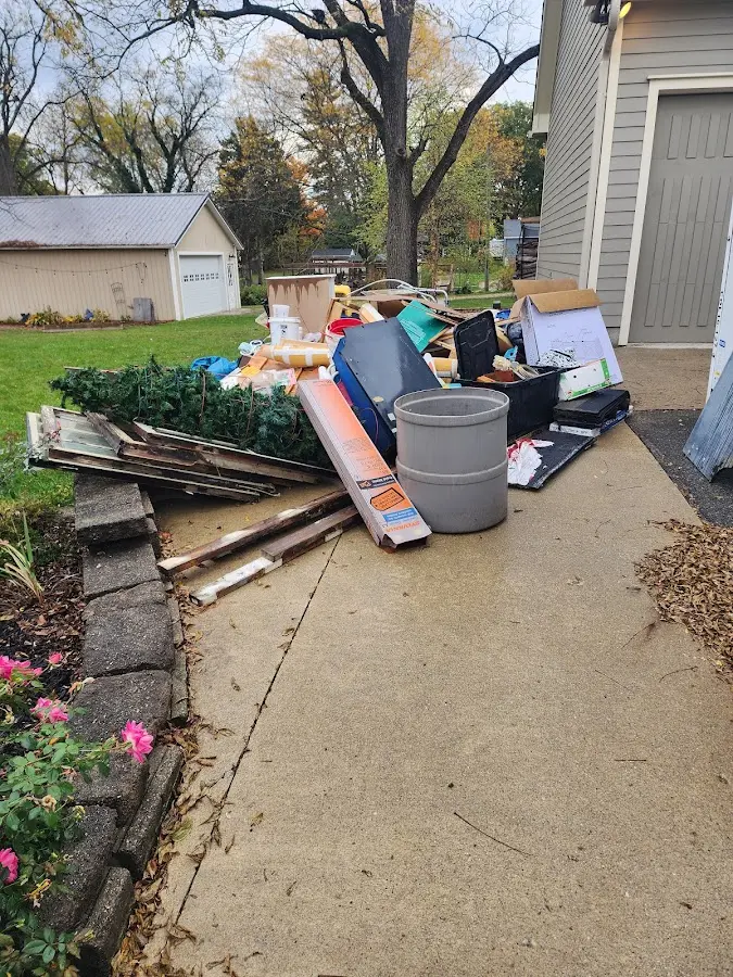 Dumpster being loaded with debris for 10 Yard Dumpster Rental in Wormleysburg